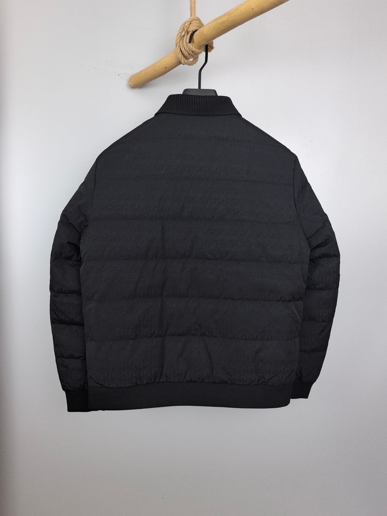 Prada puffer jacket back view with stand collar and quilted horizontal stitching