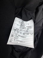 Prada puffer jacket interior care label tag near collar seam