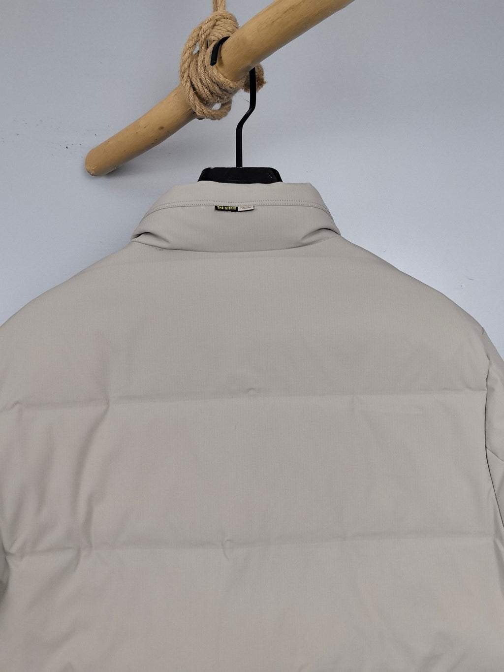 Light beige padded jacket back with stand collar