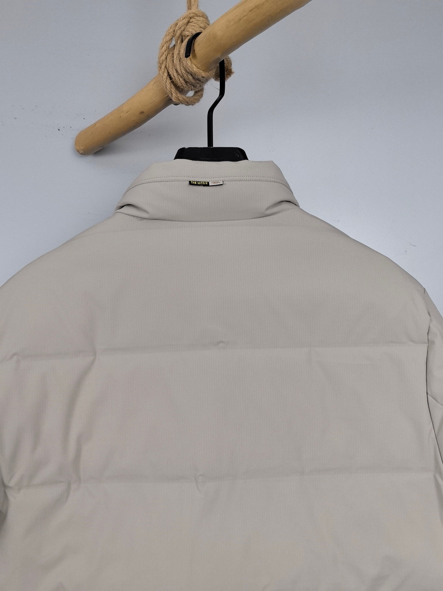 Light beige padded jacket back with stand collar