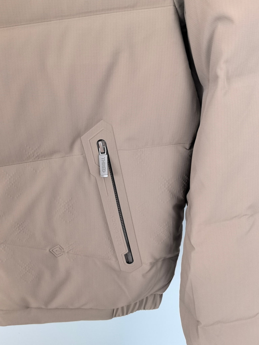 Prada puffer jacket taupe with vertical zip pocket on sleeve