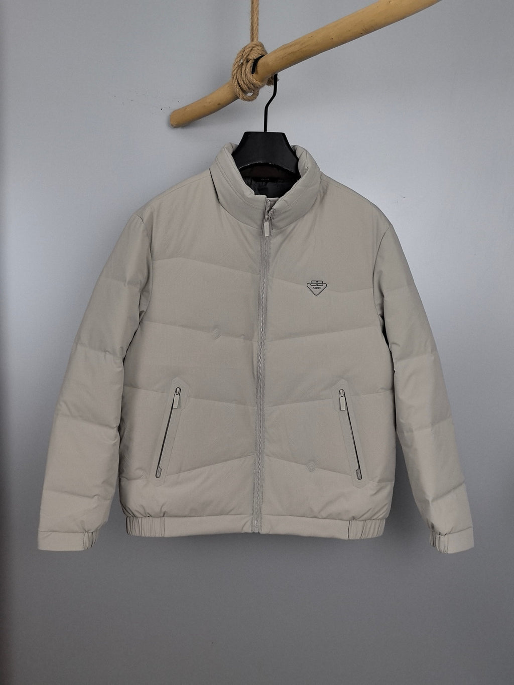 Light beige padded jacket with full-zip and stand collar, front view