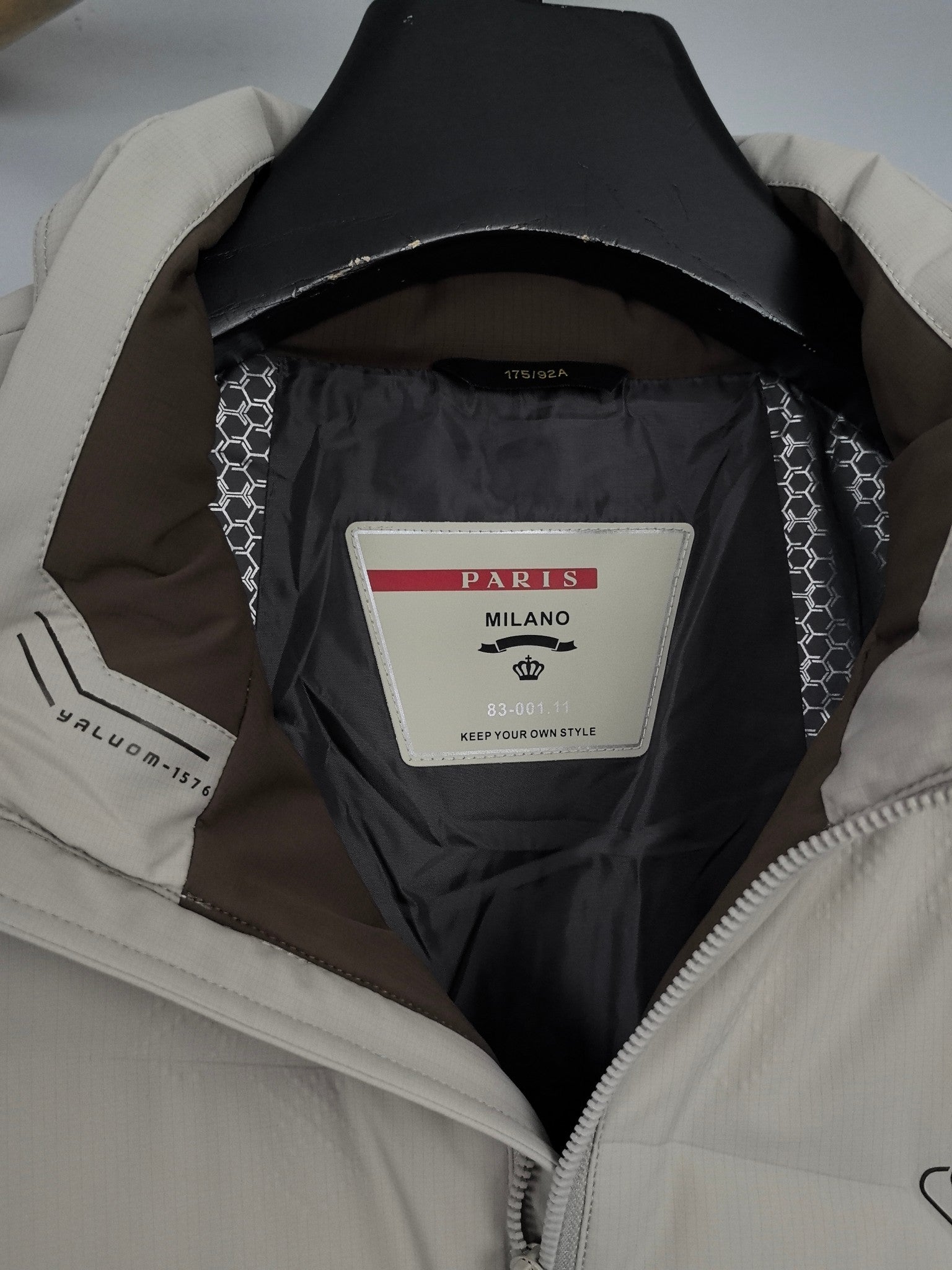 Light beige padded jacket interior with Paris Milano label