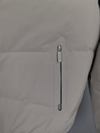 Light beige padded jacket sleeve with zip pull and logo patch