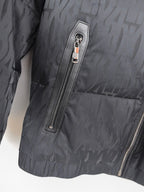 Prada puffer jacket detail: vertical chest zipper pocket with stitched label panel