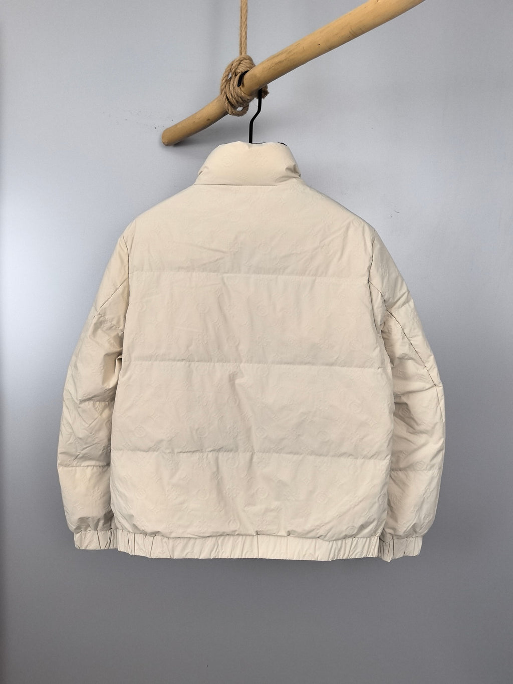 Burberry puffer jacket, back view in cream with horizontal baffles