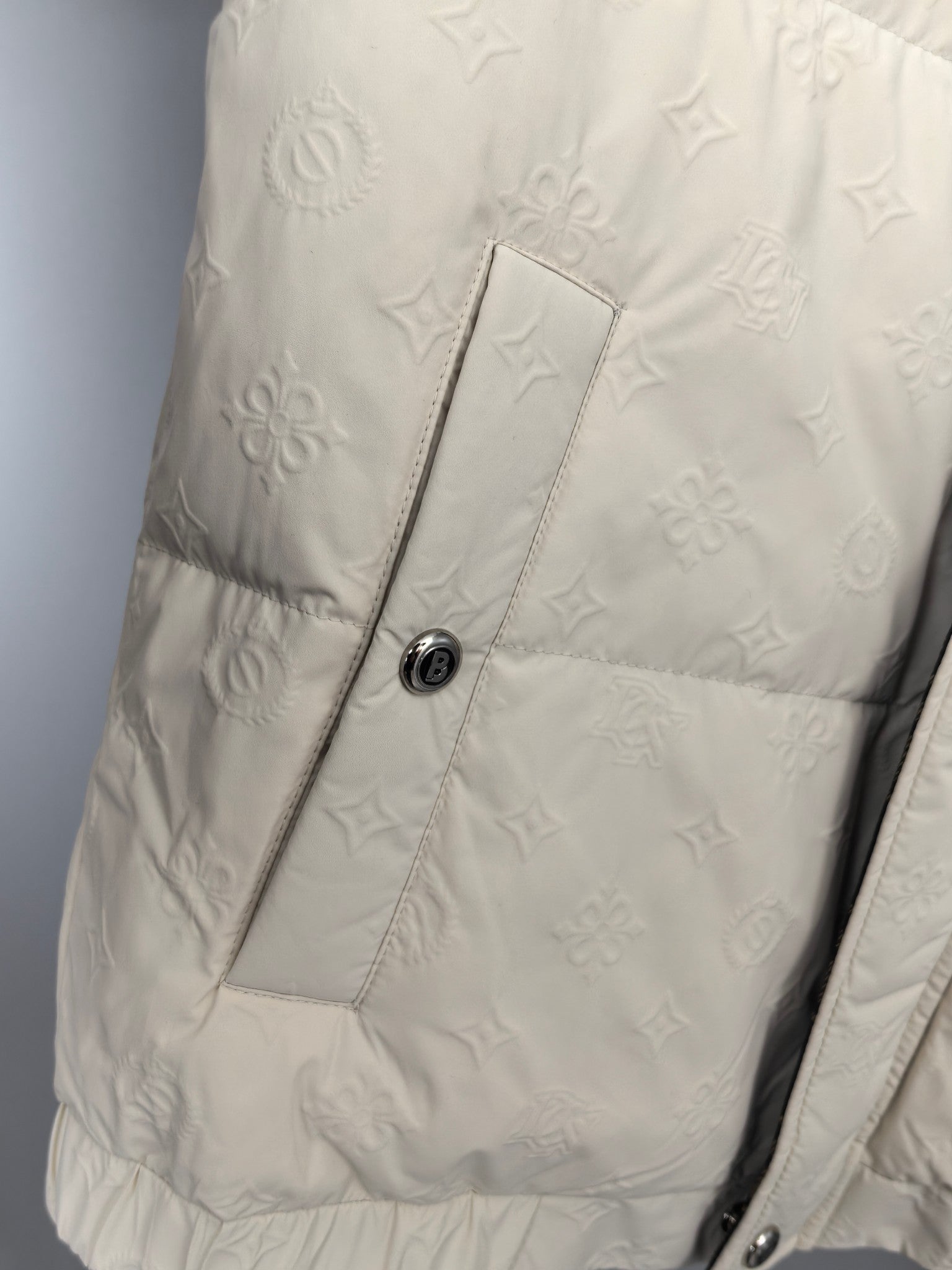 Burberry puffer jacket pocket panel, cream textured monogram and stitched seams