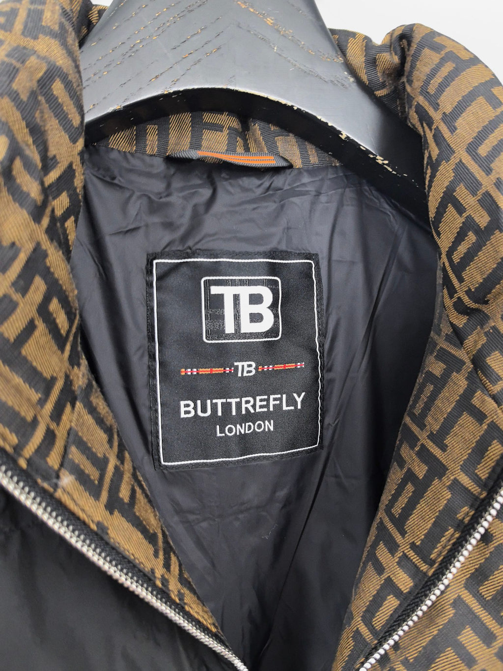 Jacket interior label patch reading TB BUTTERFLY LONDON