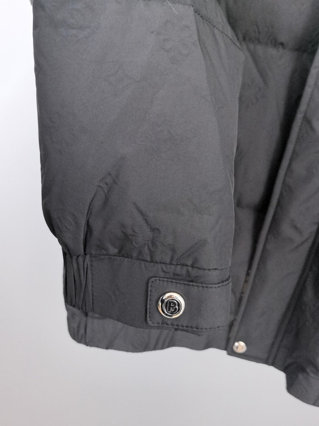 Long puffer jacket, black, adjustable hem with logo patch and snap