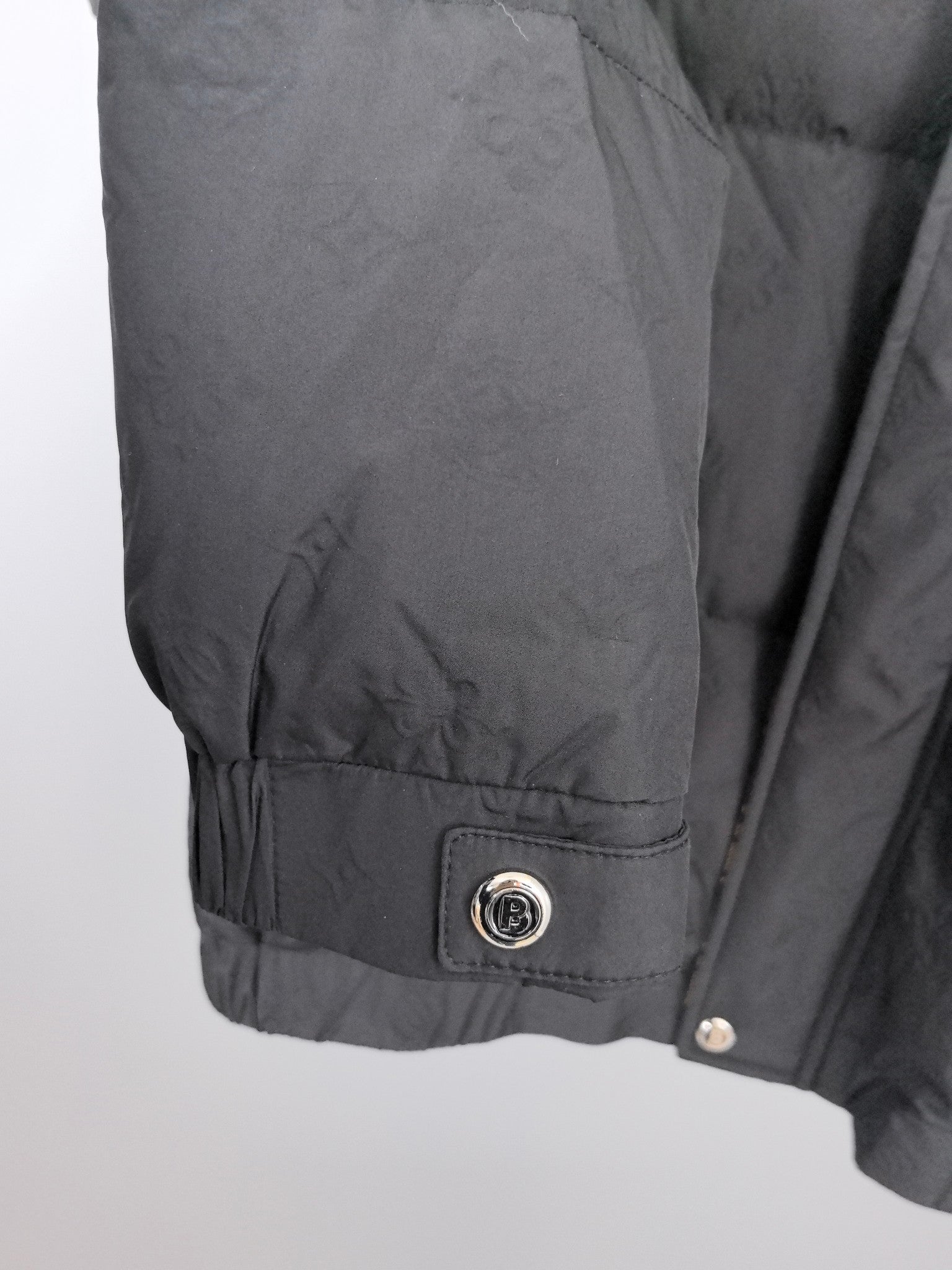 Long puffer jacket, black, adjustable hem with logo patch and snap