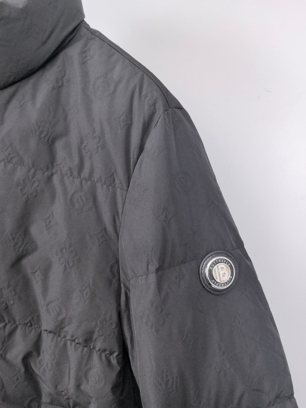 Long puffer jacket, black, side sleeve with circular logo patch