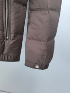 Brown puffer jacket cuff with snap button