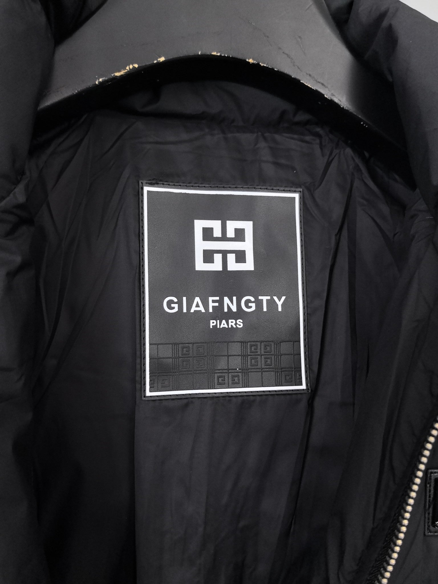 Black jacket interior logo patch label with GIÀFNGTY PARIS text