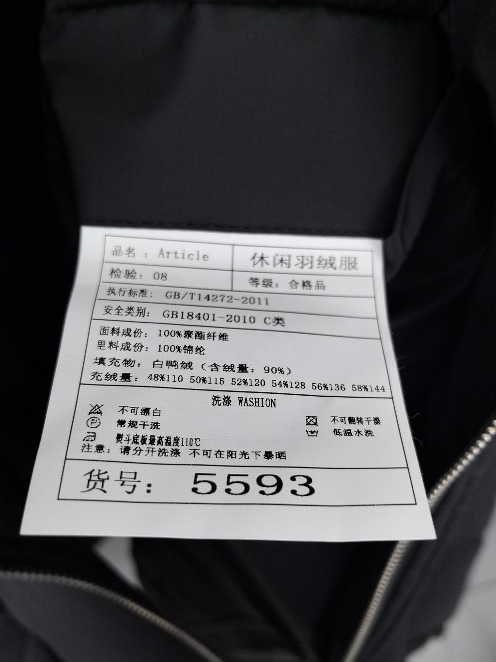 Jacket size and care label showing item number 5593