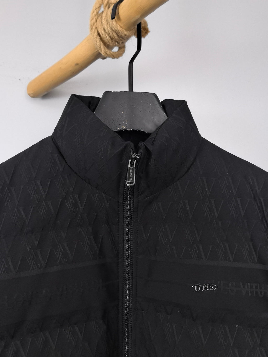 Black puffer jacket with stand collar and front zipper opening