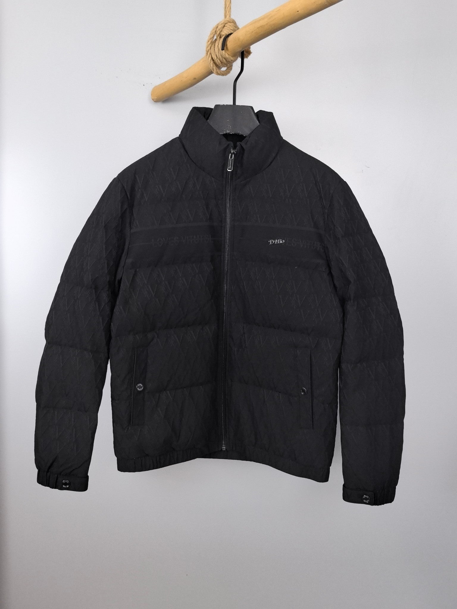 Black quilted puffer jacket with stand collar and front zipper