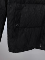Black quilted puffer jacket front panel with circular logo patch