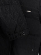 Black puffer jacket with monogram pattern and small chest logo