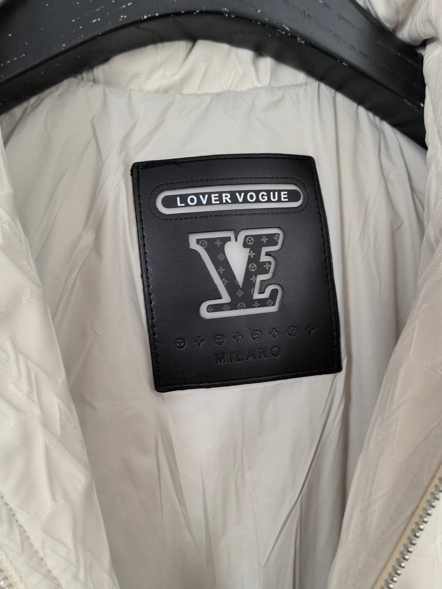 Louis Vuitton branded interior label patch on white puffer jacket lining