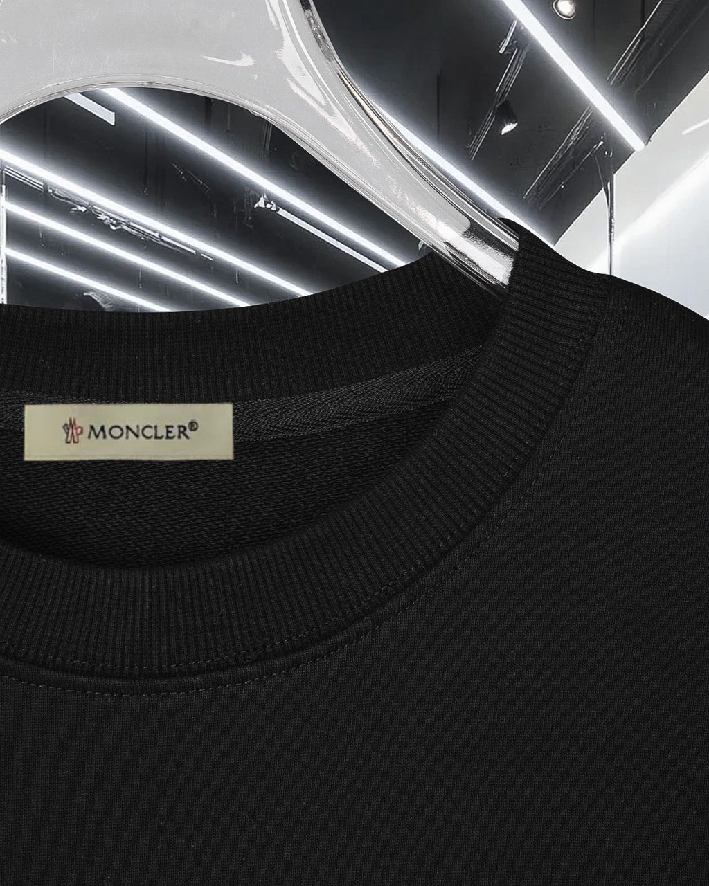 Black crewneck sweatshirt with Moncler neck label