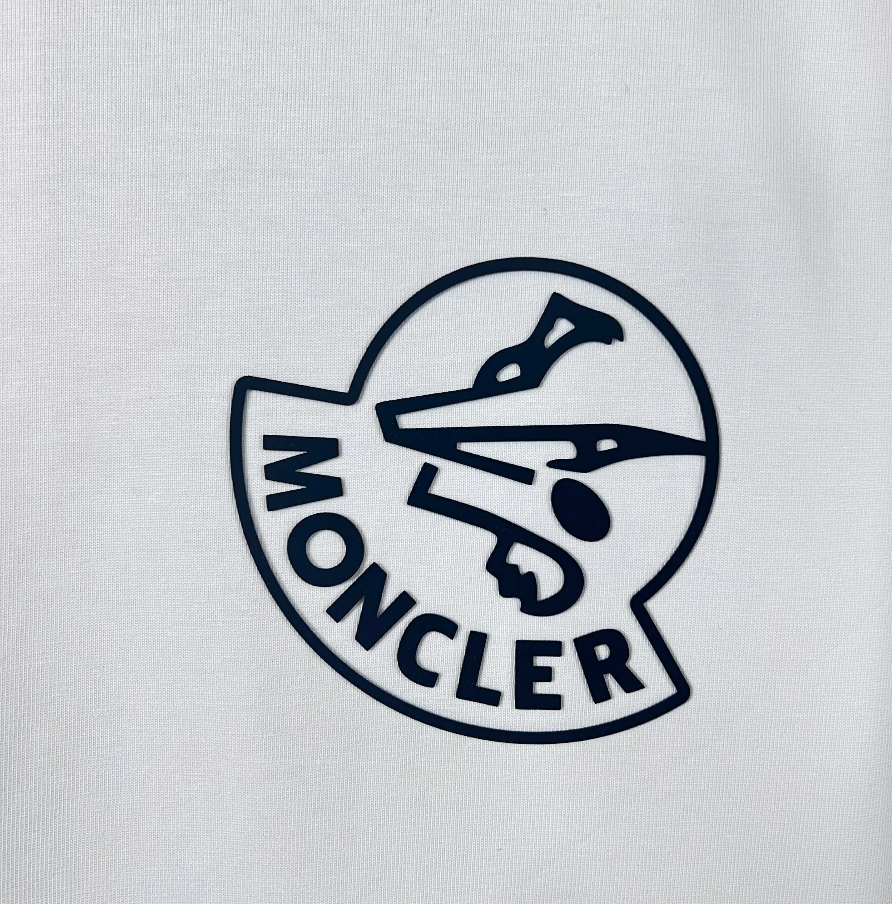 Moncler crest logo on white sweatshirt chest