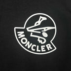 Moncler circular logo on black sweatshirt fabric