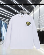 Moncler long-sleeve sweatshirt in white with smiley face chest patch logo