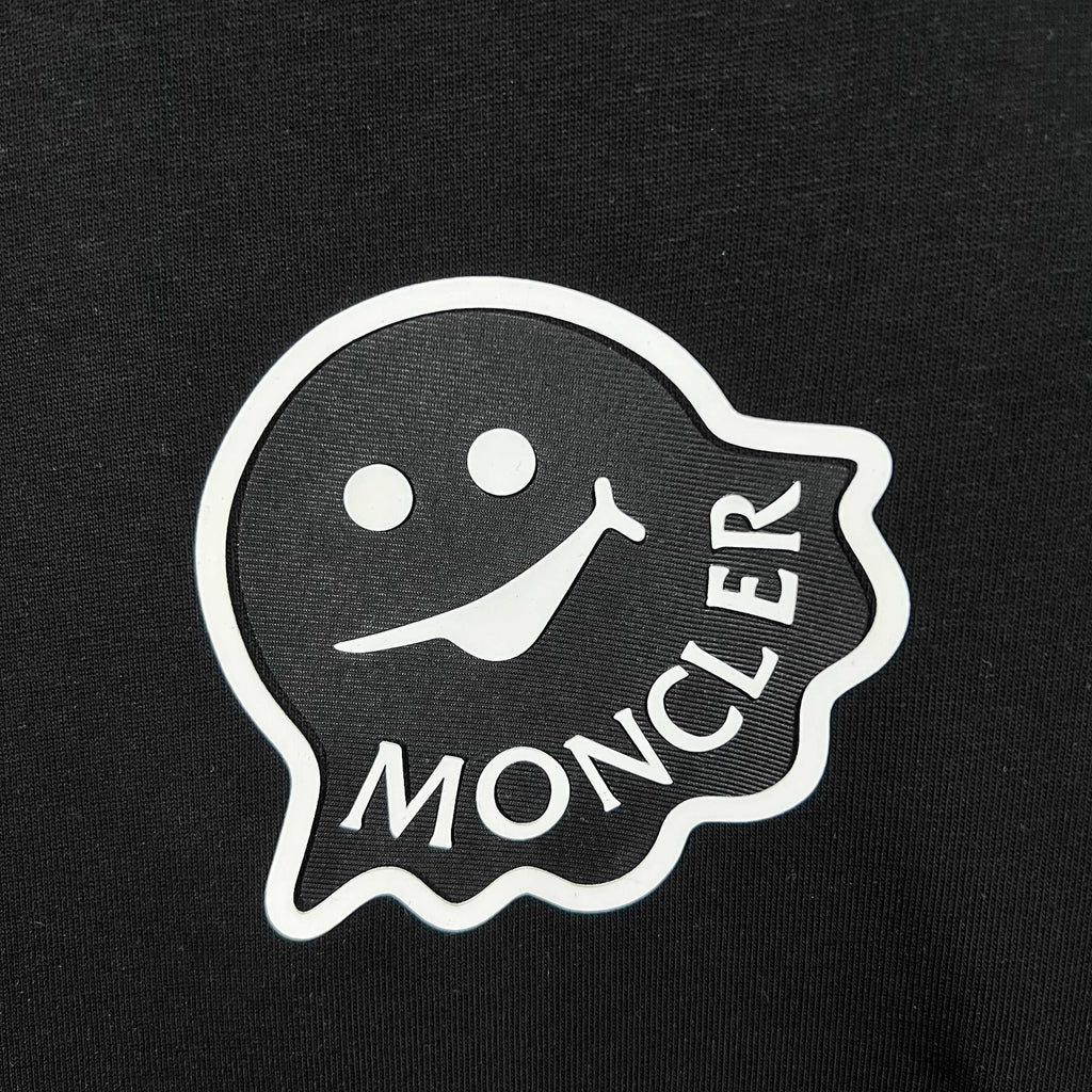 Moncler logo patch on black fabric