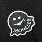 Moncler logo patch on black fabric