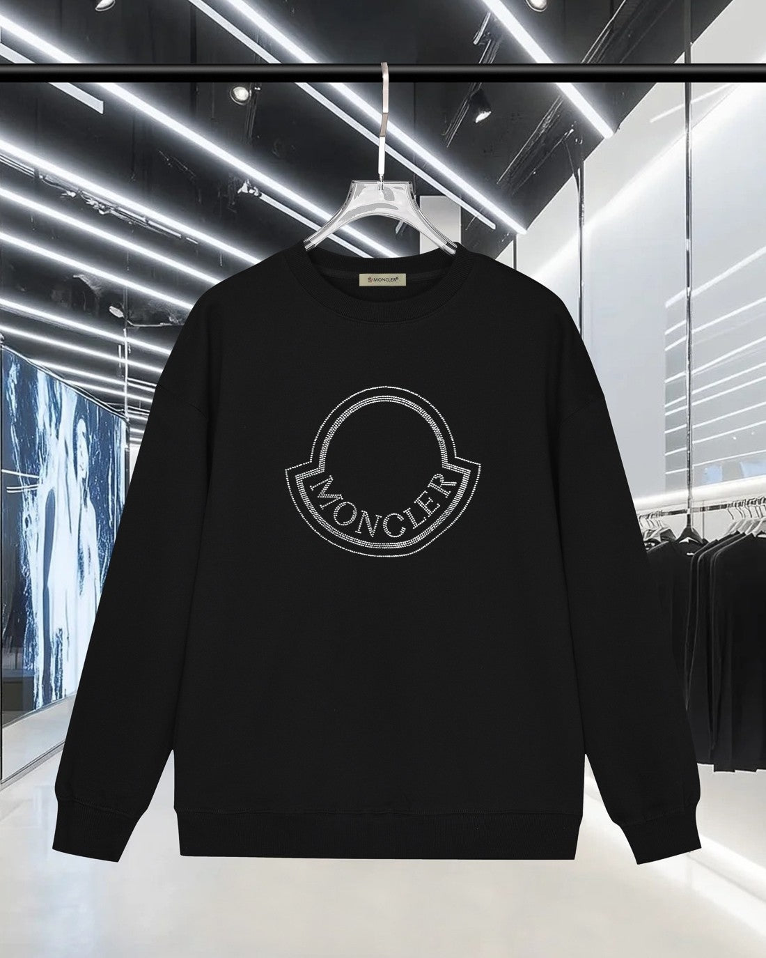 Black long-sleeve sweatshirt with rhinestone Moncler logo on the chest