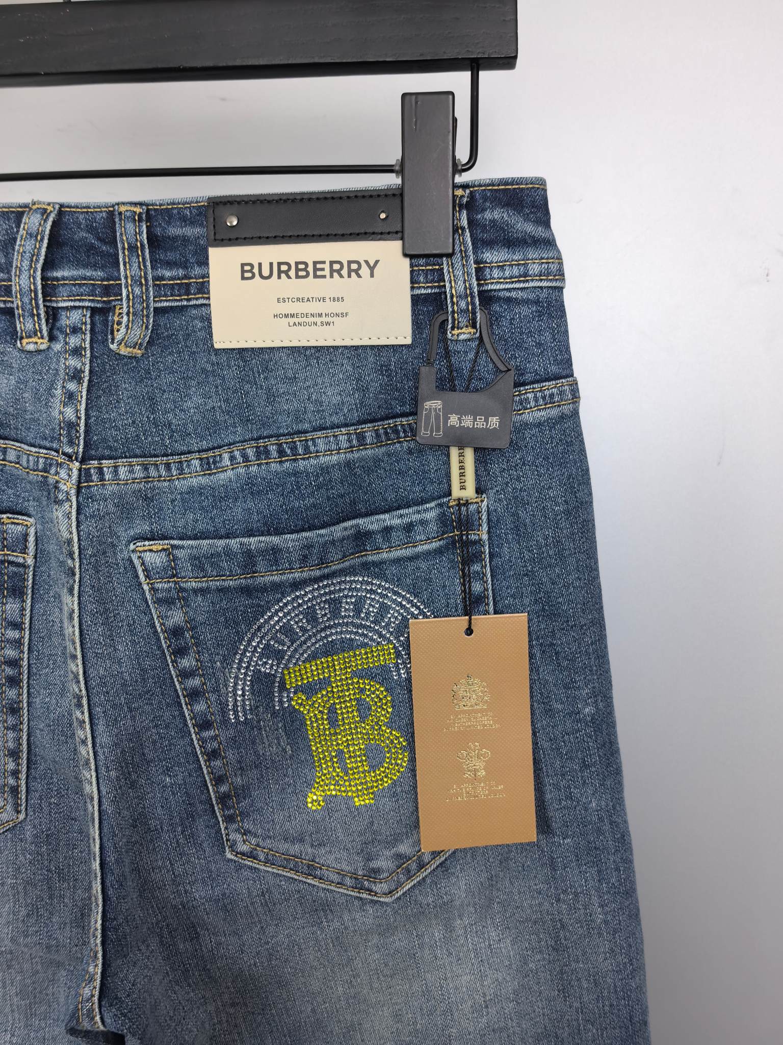 Denim pants back patch with Burberry tag and logo graphic on pocket