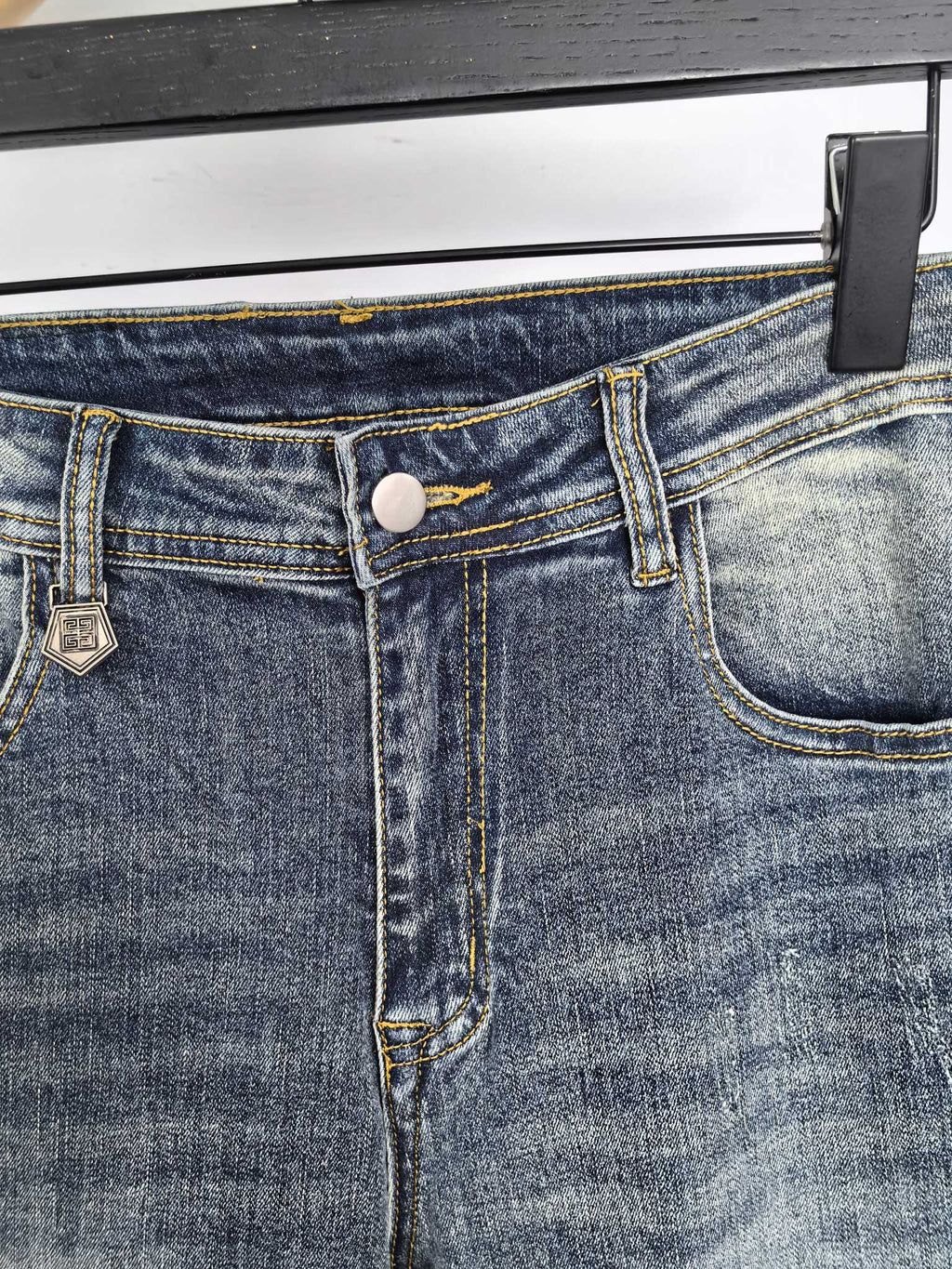 Givenchy denim jeans close-up of waistband button and belt loops
