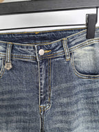 Givenchy denim jeans close-up of waistband button and belt loops