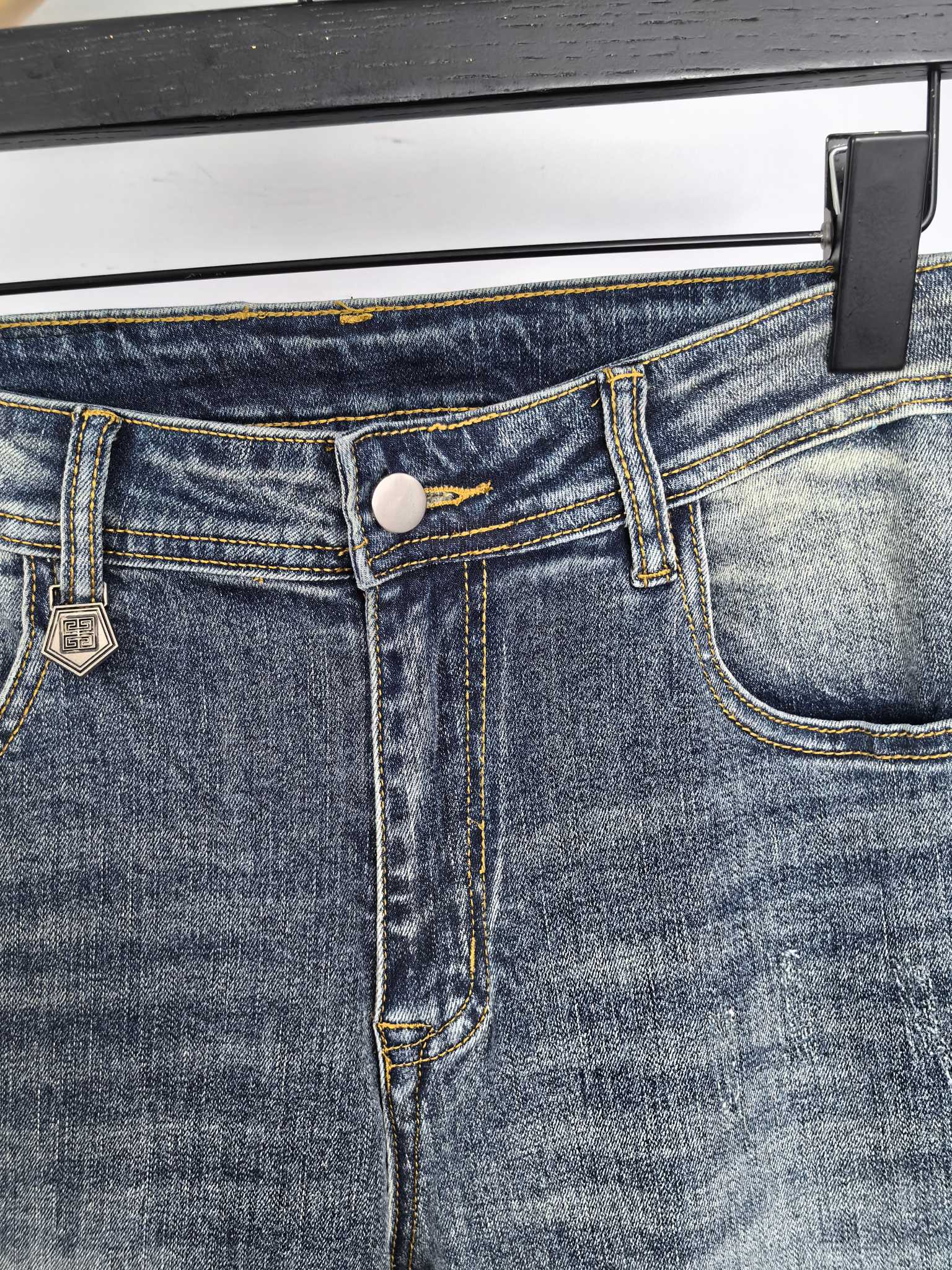Givenchy denim jeans close-up of waistband button and belt loops