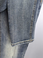 Givenchy blue denim jeans close-up of hem and contrast stitching