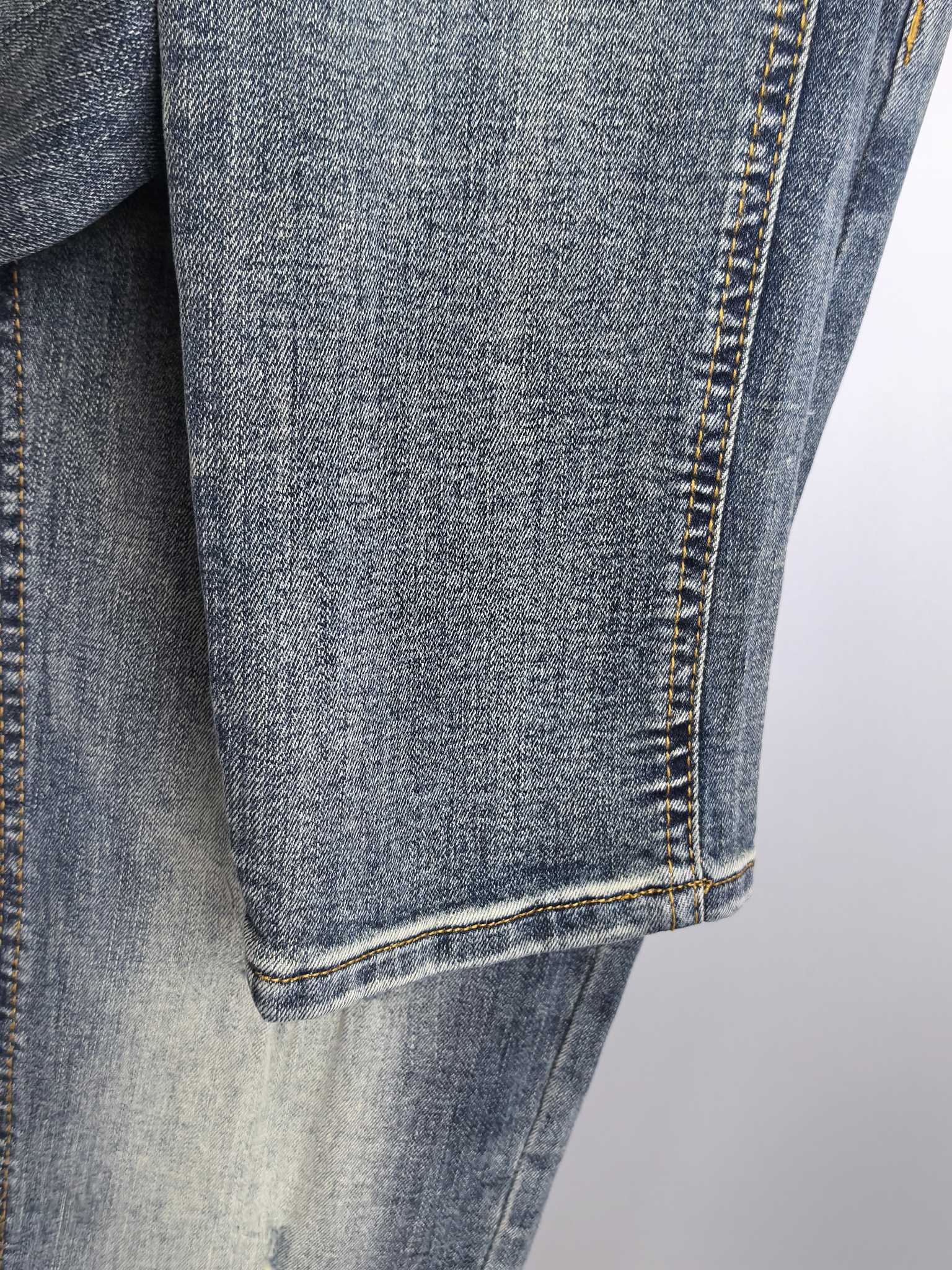 Givenchy blue denim jeans close-up of hem and contrast stitching