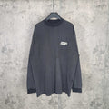 Balenciaga long-sleeve top, dark charcoal gray, small chest logo patch