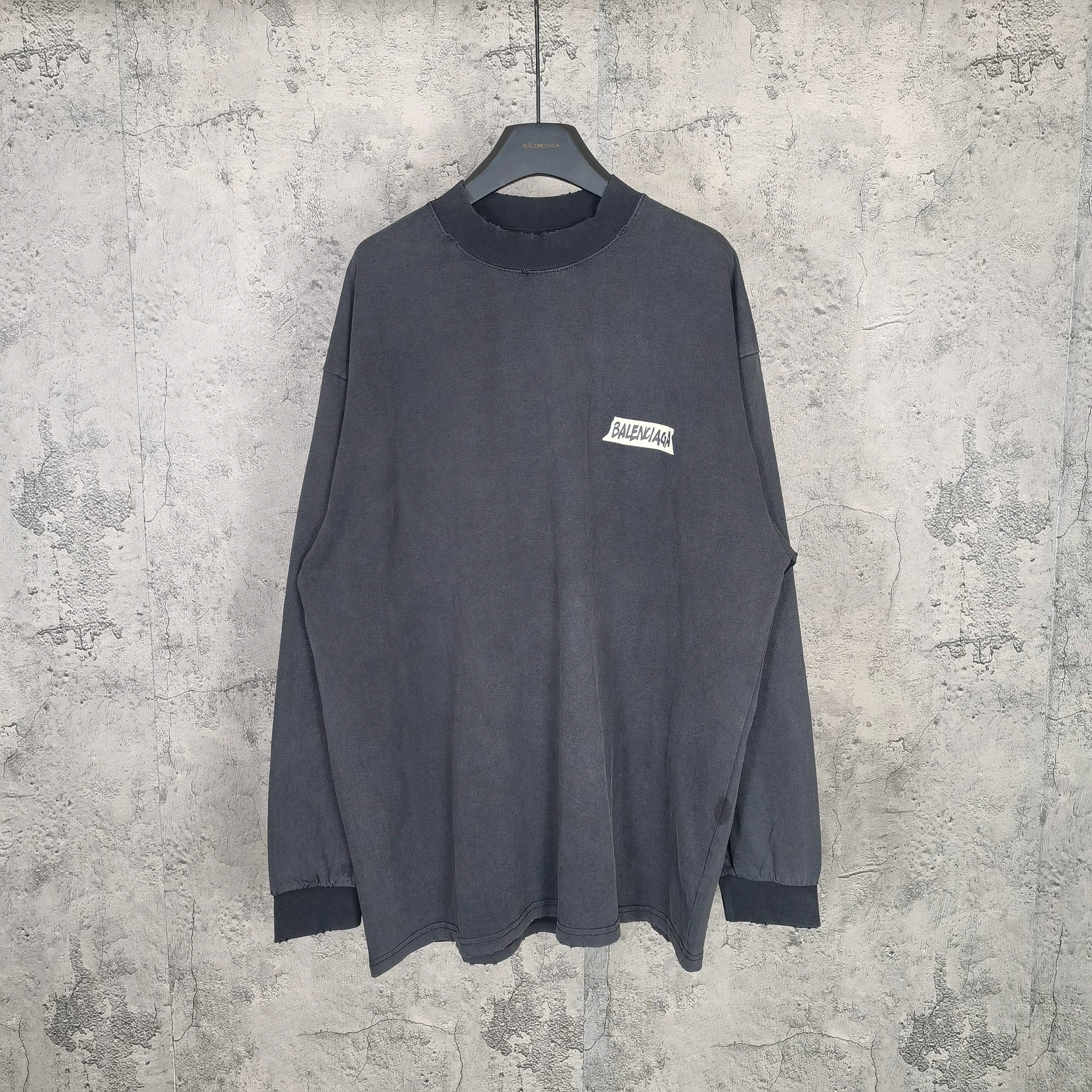 Balenciaga long-sleeve top, dark charcoal gray, small chest logo patch