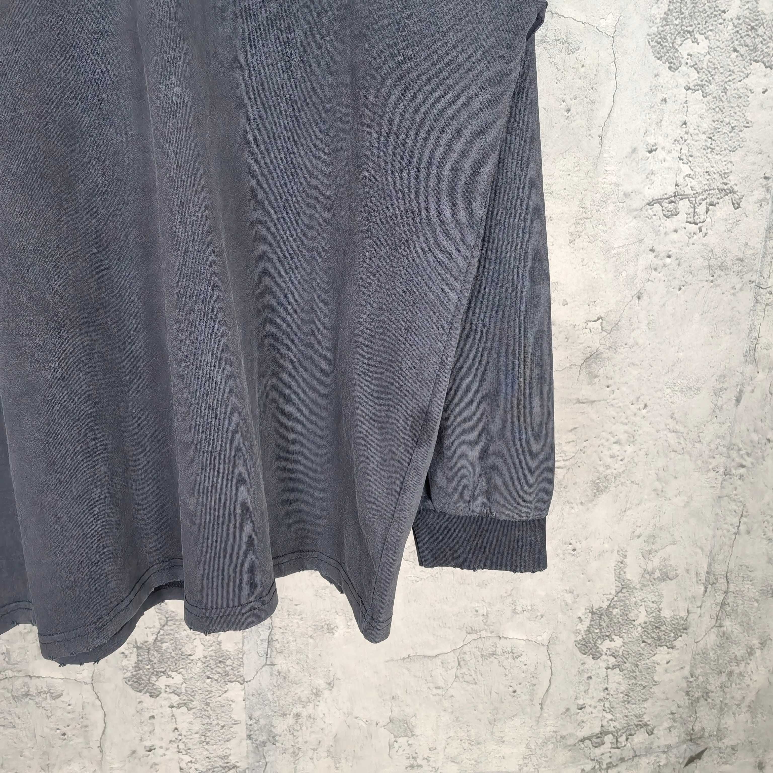 Balenciaga long-sleeve top, side split hem and ribbed sleeve cuffs