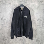 Black zip-up hoodie jacket with hood and chest logo patch