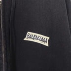 Close-up of black hoodie jacket with BALENCIAGA logo on chest