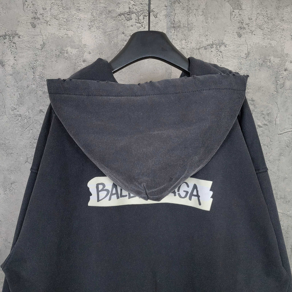 Dark zip-up hoodie jacket with hood and large back logo text