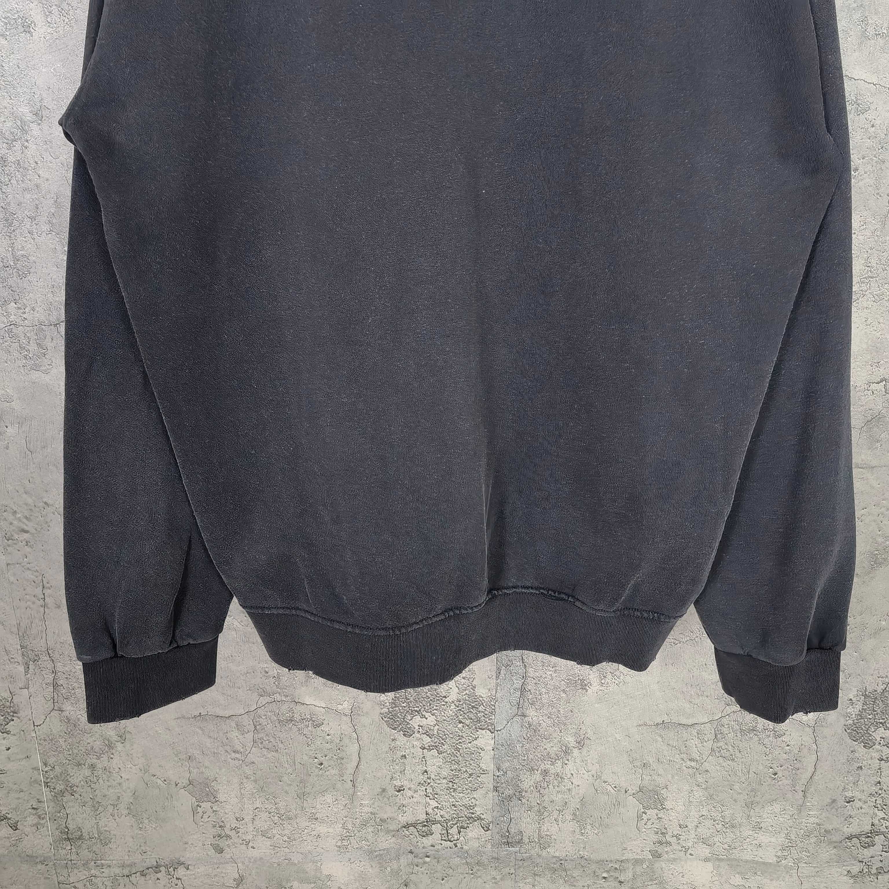 Zip-up hoodie back view with relaxed fit and ribbed hem, dark blue