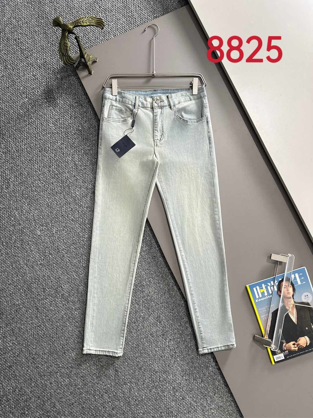 Light-wash denim pants with belt loops, button fly, and straight-leg fit