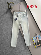 Light-wash denim pants with belt loops, button fly, and straight-leg fit