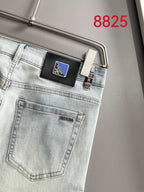 Light-wash denim pants back pocket with PRADA leather patch label
