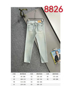 Light wash denim pants with front pockets, belt loops, and button-closure fly