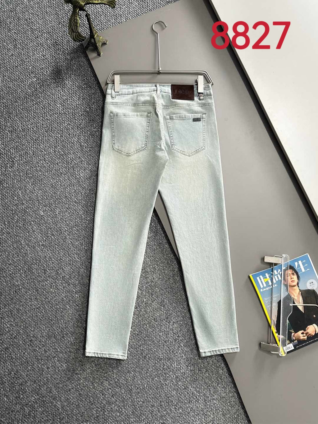 Light blue denim pants with five-pocket design and belt loops