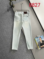 Light blue denim pants with five-pocket design and belt loops