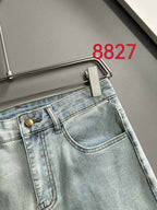 Light blue denim jeans waistband with logo button and front seam stitching